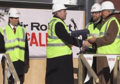 The topping out ceremony, John Hood receives his ceremonial trowel
